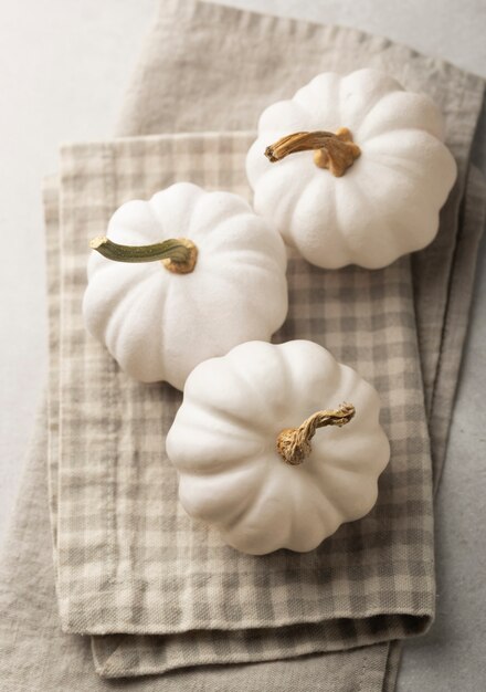 Top view white pumpkins on cloths