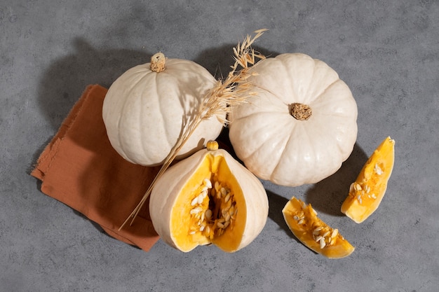 Top view white pumpkins and grey background