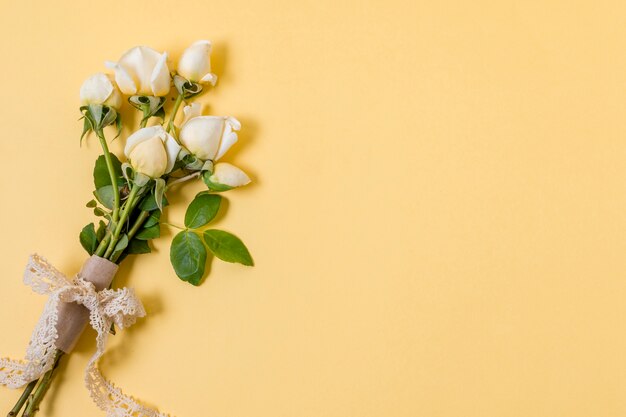 Top view white roses bouquet with copy space