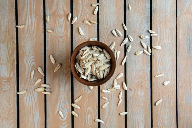 Top view of white sunflower seeds in a clay pot