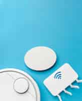 Free photo top view of wi-fi router with vacuum cleaner and copy space