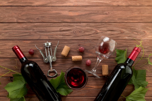 Top view wine bottles on wooden background