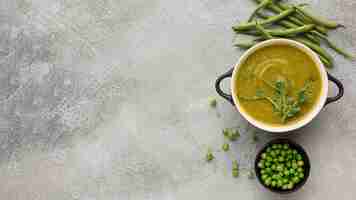 Free photo top view of winter peas soup in bowl with copy space