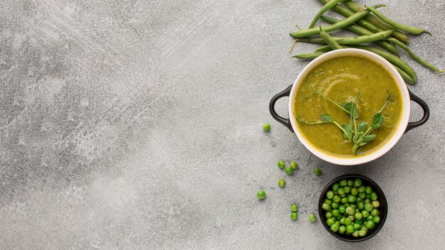 Top view of winter peas soup in bowl with copy space