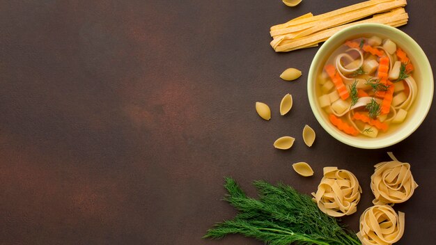 Top view of winter vegetables soup in bowl with copy space