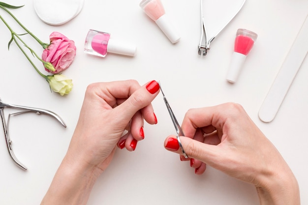 Top view woman doing hand manicure