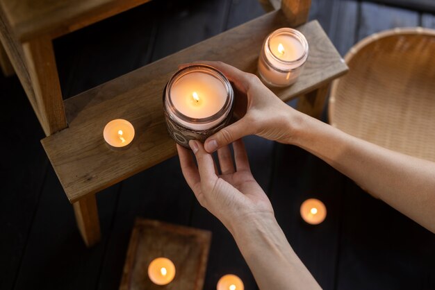 Top view woman holding candle