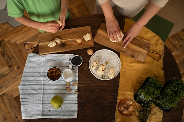 Top view woman and kid preparing food