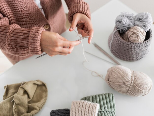 Top view woman knitting