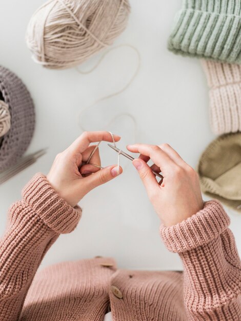 Top view woman knitting