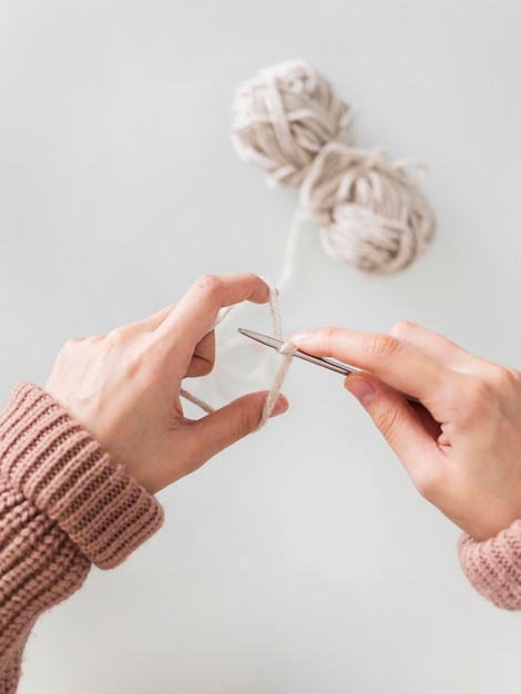 Free photo top view woman knitting