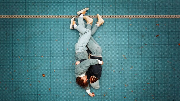 Top view woman and man lying on the floor