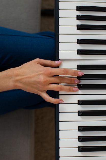 Top view woman playing piano