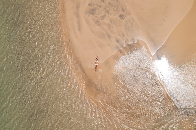 Top view woman tanning on the beach