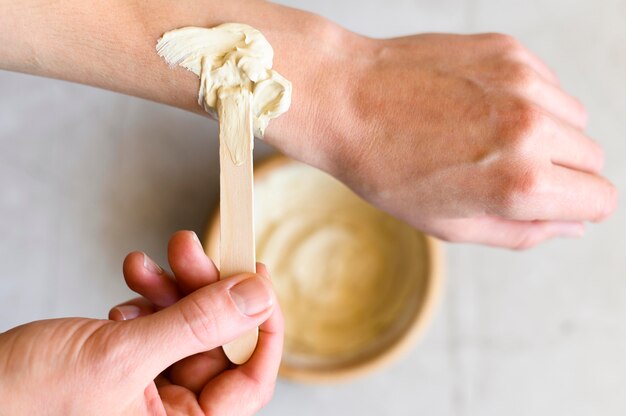 Top view of woman using lotion on her hands