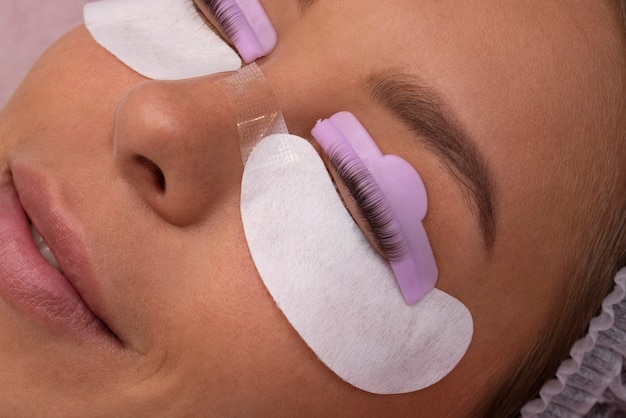 Free photo top view woman wearing eye patches