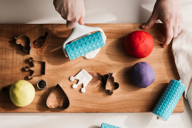 Top view of woman with colorful plasticine