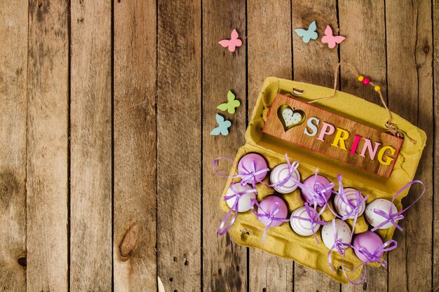 Top view of wooden background with eggs for easter