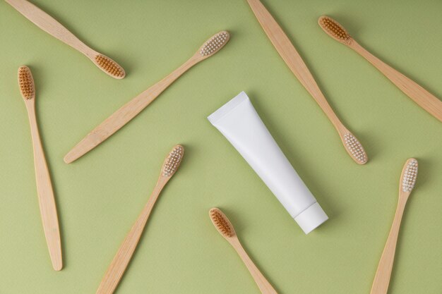 Top view wooden brushes and container arrangement