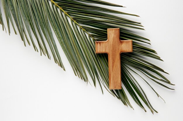 Top view wooden cross on leaf