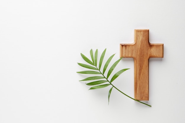 Top view wooden cross and leaf