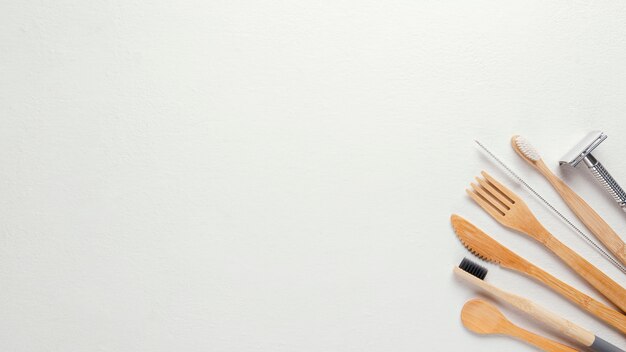 Top view wooden cutlery and razor