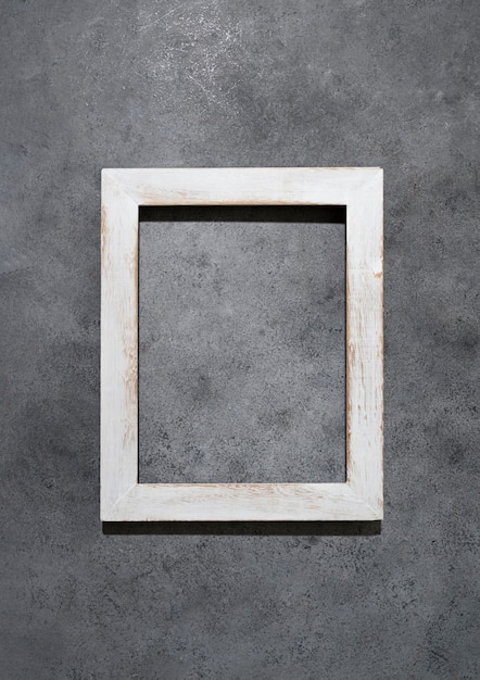 Top view wooden frame on grey background