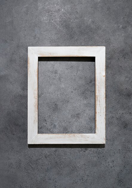 Top view wooden frame on grey background