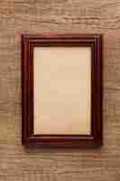 Free photo top view of wooden frame with copy space