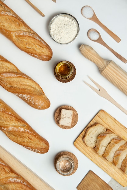 Free photo top view wooden kitchen tools  and bread