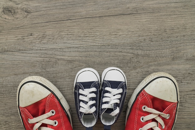 Top view of wooden surface with colored shoes