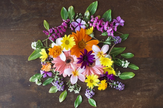 Top view of wooden surface with pretty flowers