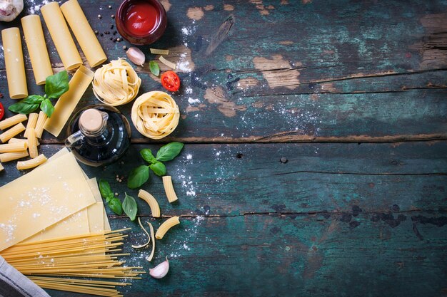 Top view of wooden table with different kind of pasta