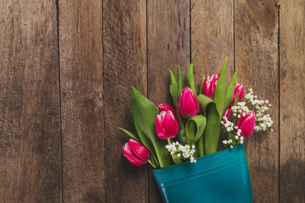 Top view of wooden table with flowers