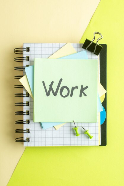 top view work written note on stickers on yellow background college job office copybook color school photo money salary