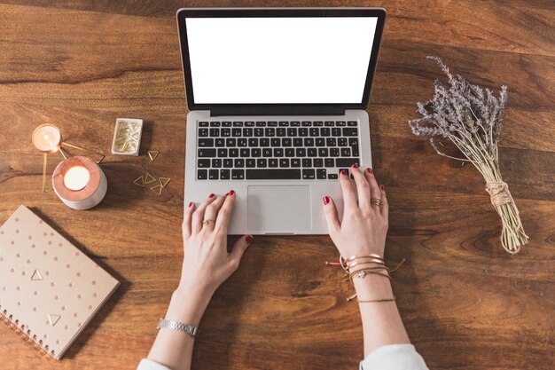 Top view of worker using a laptop