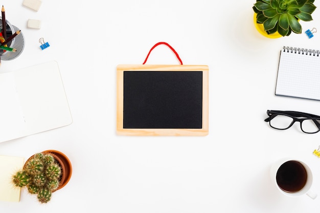 Top view workspace concept with chalkboard