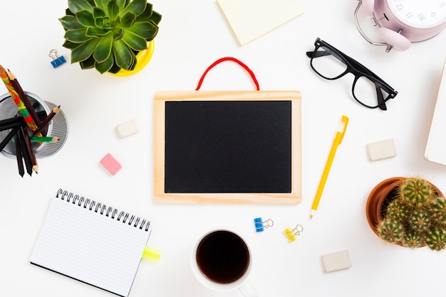 Top view workspace concept with chalkboard