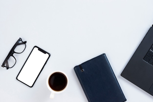 Top view workspace concept with mock-up smartphone