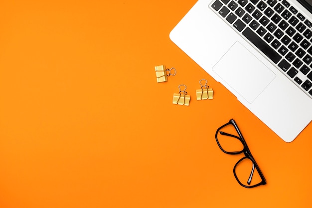 Free photo top view workspace concept with orange background