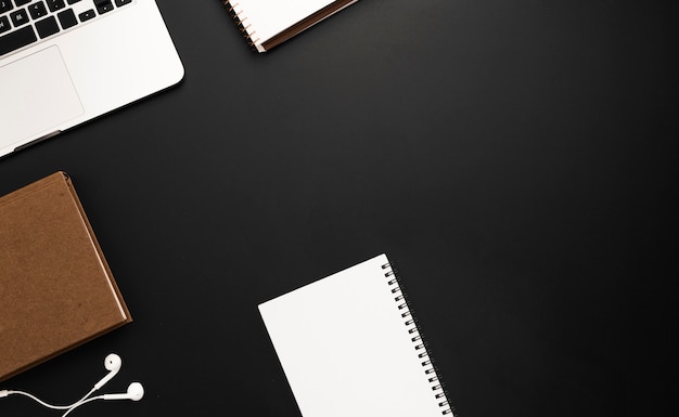 Top view of workspace with agenda and notebook