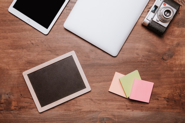 Top view of workspace with slate and post its