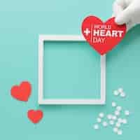 Free photo top view world heart day concept with frame