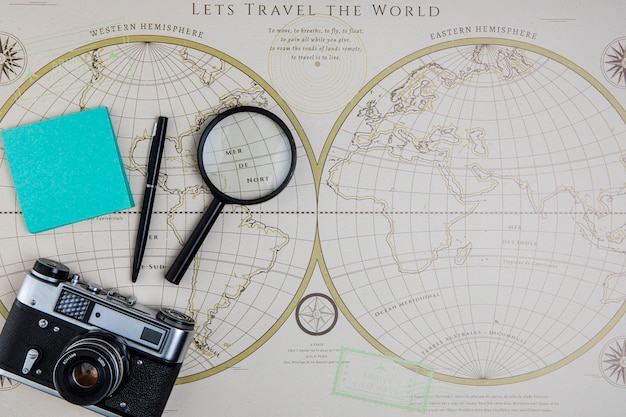 Top view world map and traveling tools