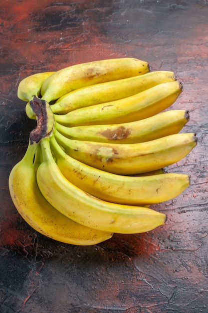 Top view yellow bananas on dark background