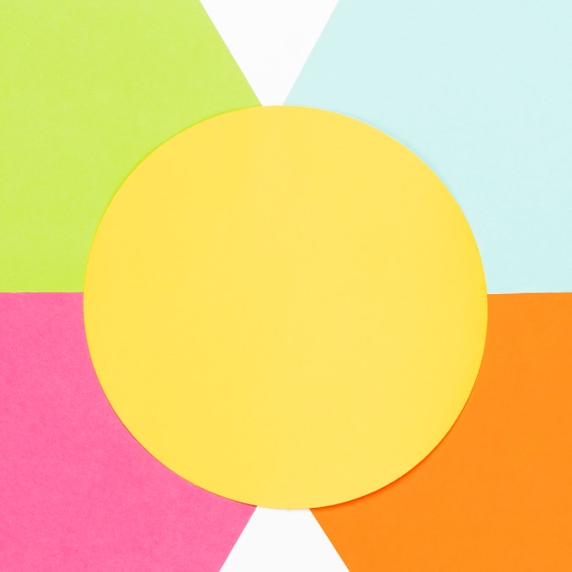 Top view yellow circle with colorful geometric shapes