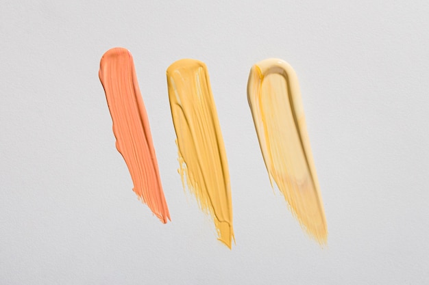 Top view of yellow paint brush strokes