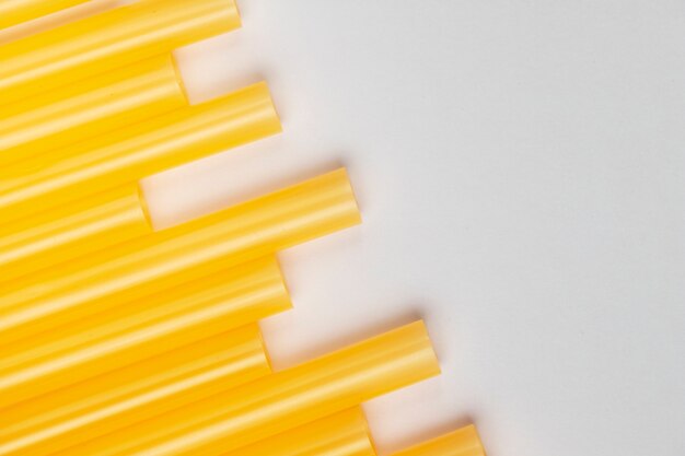 Top view yellow plastic drinking straws