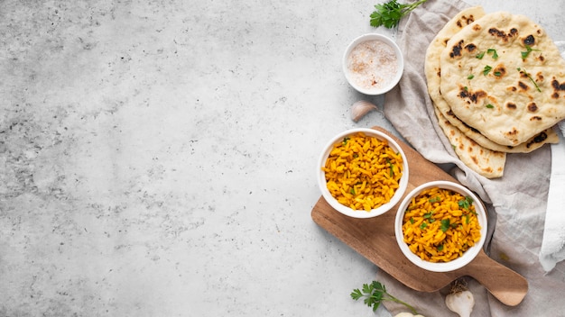 Top view yellow rice and pita arrangement