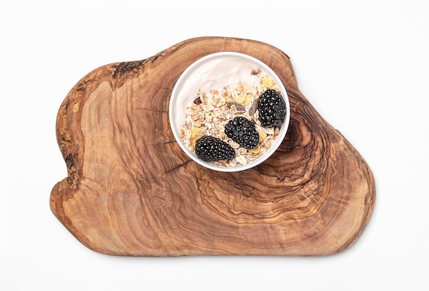 Top view yogurt with oats and blackberries